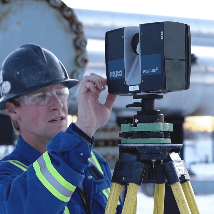 a LIDAR technician operates a 3D laser scanning system